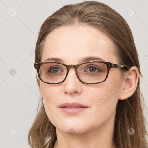 Joyful white young-adult female with long  brown hair and blue eyes