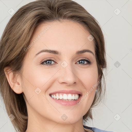 Joyful white young-adult female with medium  brown hair and green eyes