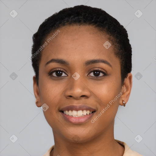 Joyful black young-adult female with short  black hair and brown eyes