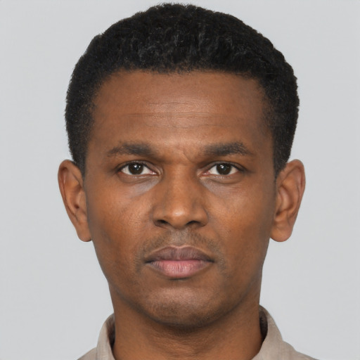 Neutral black young-adult male with short  black hair and brown eyes