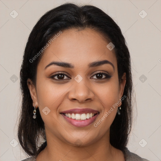 Joyful latino young-adult female with medium  brown hair and brown eyes