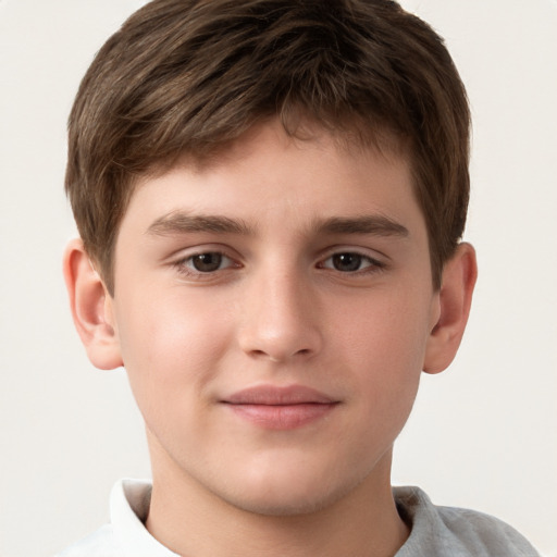 Joyful white child male with short  brown hair and brown eyes