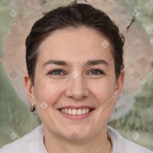 Joyful white adult female with short  brown hair and brown eyes