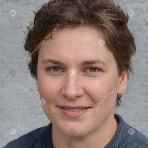 Joyful white young-adult female with short  brown hair and blue eyes