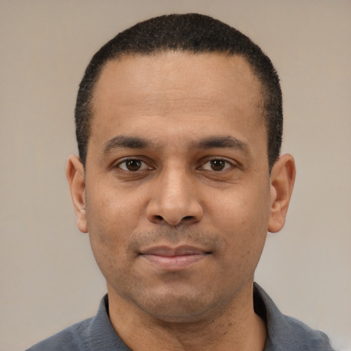 Neutral latino adult male with short  black hair and brown eyes
