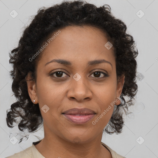 Joyful black adult female with medium  brown hair and brown eyes