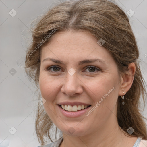 Joyful white adult female with medium  brown hair and grey eyes