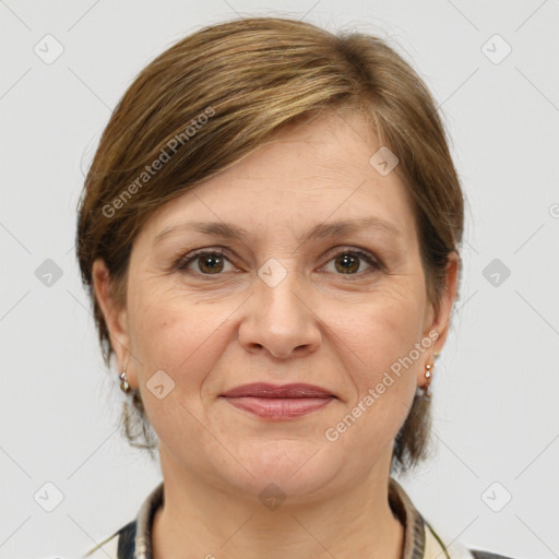 Joyful white adult female with medium  brown hair and grey eyes