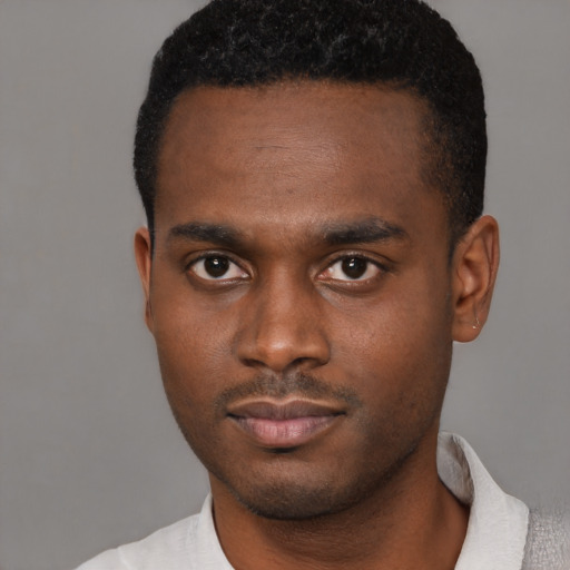 Neutral latino young-adult male with short  brown hair and brown eyes
