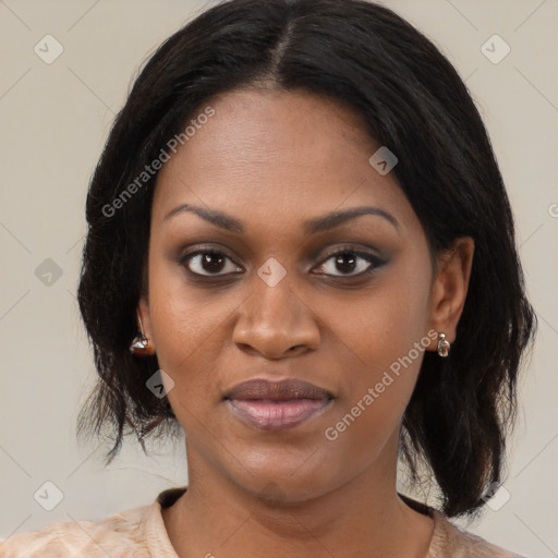 Joyful black young-adult female with medium  brown hair and brown eyes