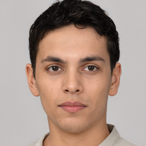 Neutral white young-adult male with short  black hair and brown eyes