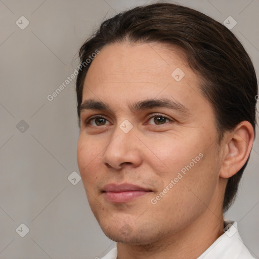 Joyful white young-adult male with short  brown hair and brown eyes