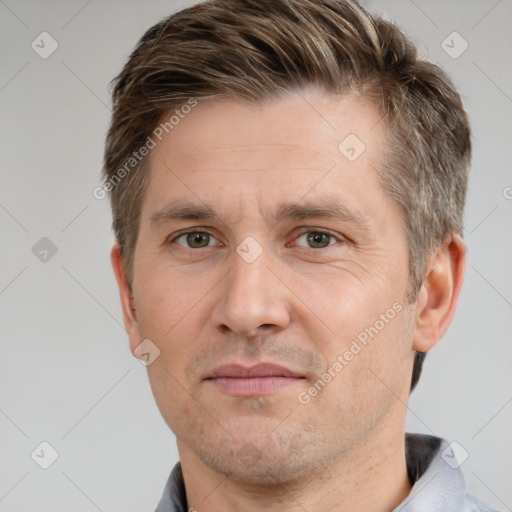 Joyful white adult male with short  brown hair and grey eyes