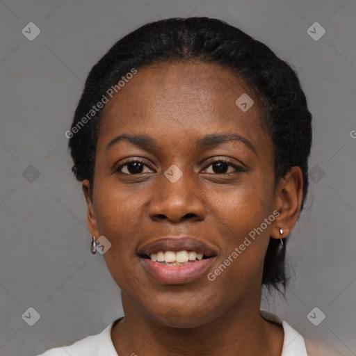 Joyful black young-adult female with short  black hair and brown eyes