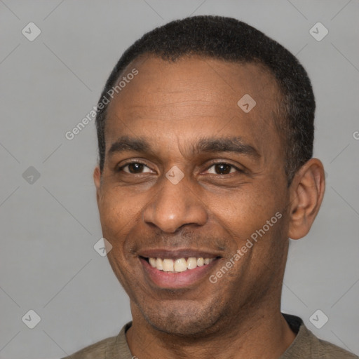 Joyful latino adult male with short  black hair and brown eyes