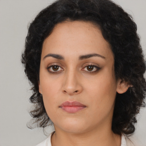 Neutral latino young-adult female with medium  black hair and brown eyes