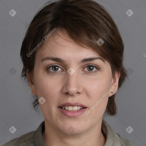 Joyful white young-adult female with medium  brown hair and grey eyes