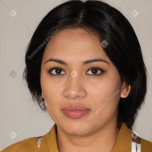 Joyful latino young-adult female with medium  black hair and brown eyes