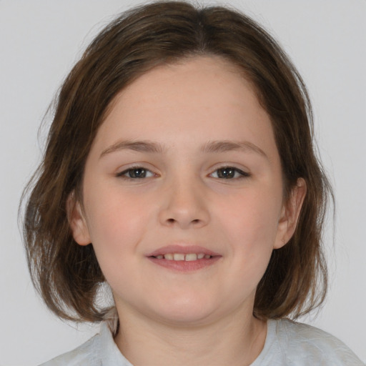 Joyful white child female with medium  brown hair and brown eyes