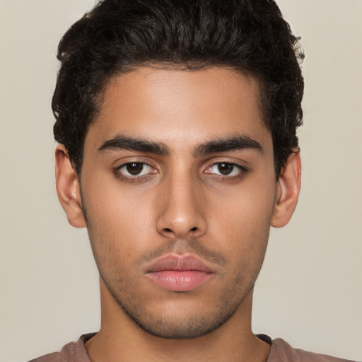 Neutral latino young-adult male with short  brown hair and brown eyes