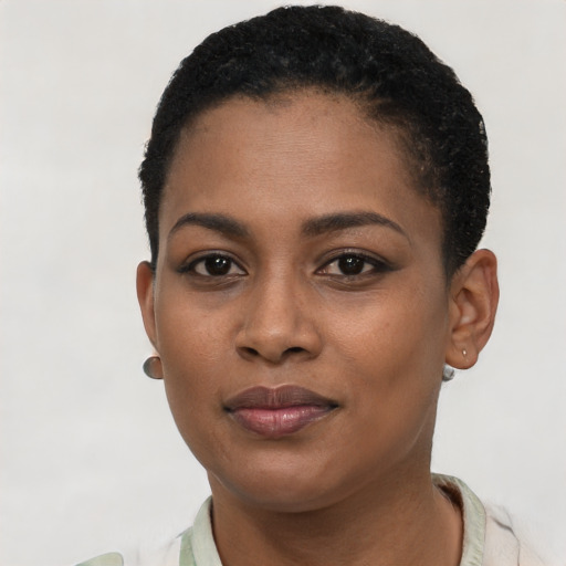 Joyful black young-adult female with short  black hair and brown eyes