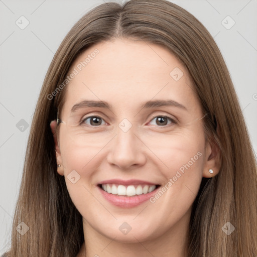 Joyful white young-adult female with long  brown hair and brown eyes