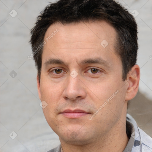 Joyful white adult male with short  brown hair and brown eyes