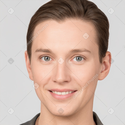 Joyful white young-adult female with short  brown hair and grey eyes