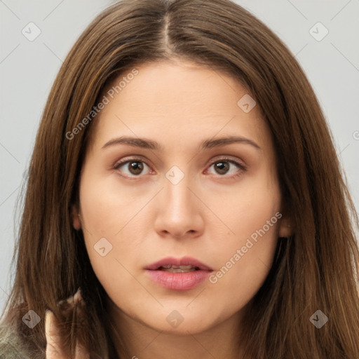 Neutral white young-adult female with long  brown hair and brown eyes