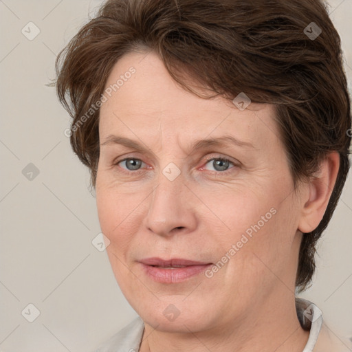 Joyful white adult female with short  brown hair and grey eyes