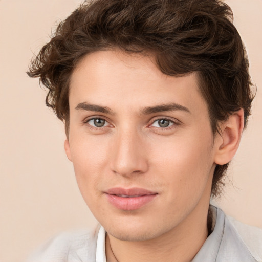 Joyful white young-adult male with medium  brown hair and brown eyes