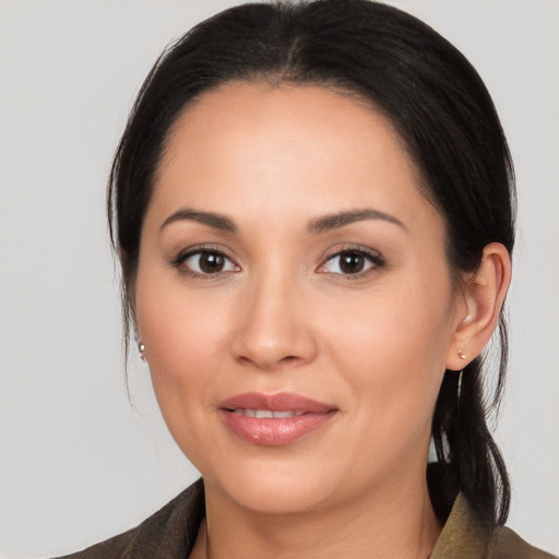 Joyful latino young-adult female with medium  brown hair and brown eyes