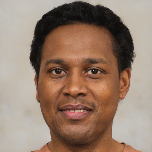 Neutral black adult male with short  black hair and brown eyes