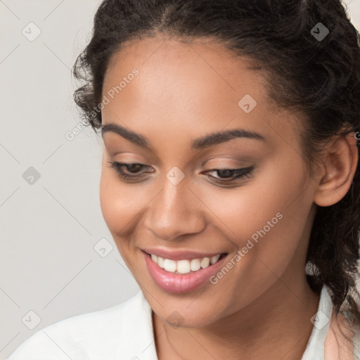 Joyful latino young-adult female with long  brown hair and brown eyes