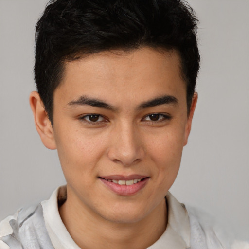 Joyful latino young-adult male with short  brown hair and brown eyes