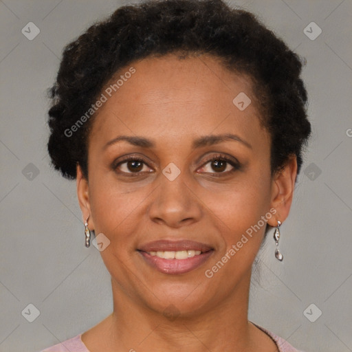 Joyful black adult female with short  brown hair and brown eyes