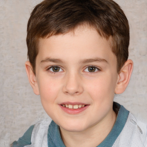 Joyful white child male with short  brown hair and brown eyes