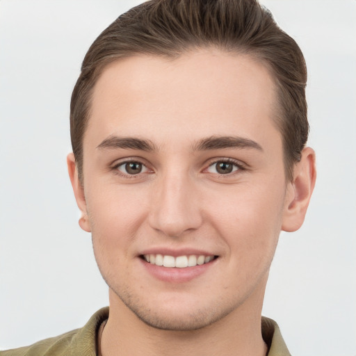 Joyful white young-adult female with short  brown hair and grey eyes