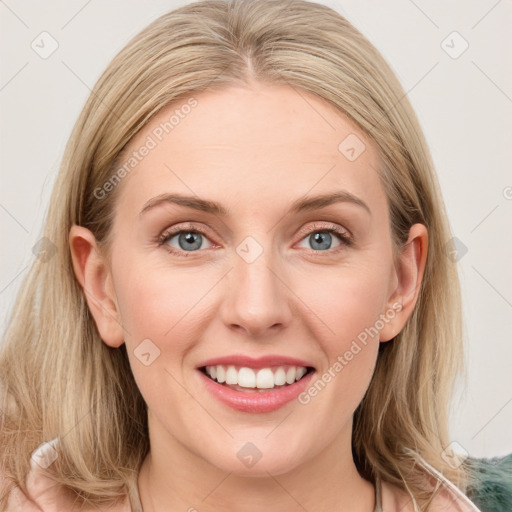 Joyful white young-adult female with medium  brown hair and blue eyes