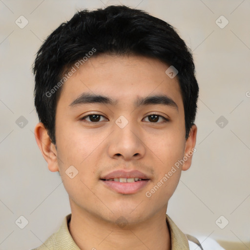 Joyful asian young-adult male with short  black hair and brown eyes