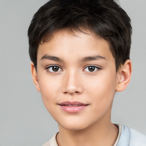 Joyful white child male with short  brown hair and brown eyes