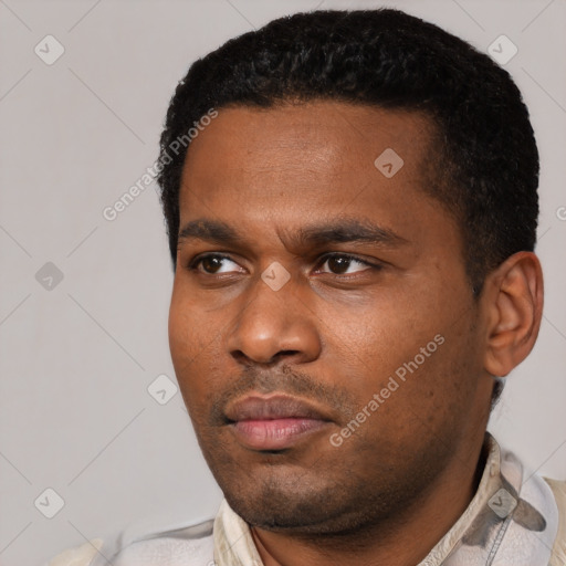 Neutral black young-adult male with short  black hair and brown eyes