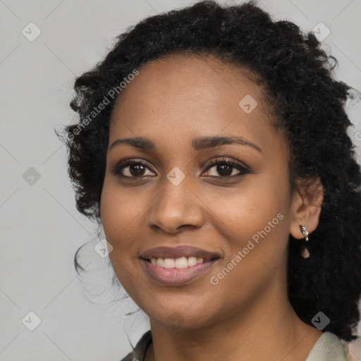 Joyful black young-adult female with medium  black hair and brown eyes