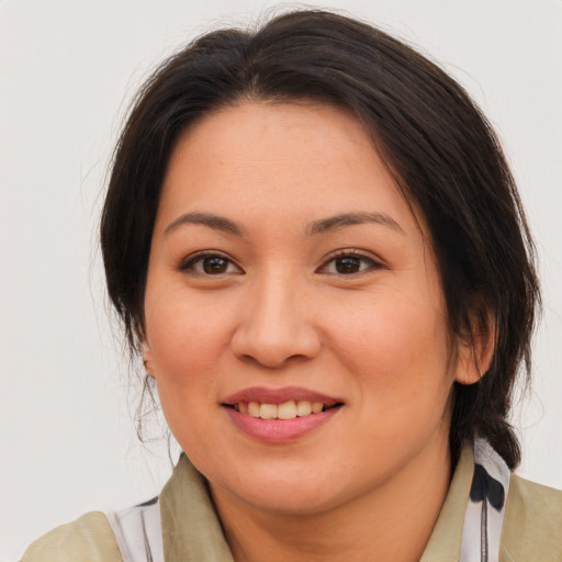 Joyful white young-adult female with medium  brown hair and brown eyes