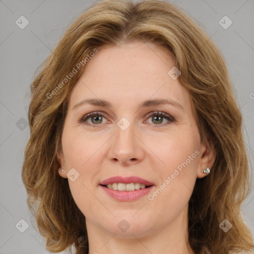 Joyful white adult female with medium  brown hair and brown eyes