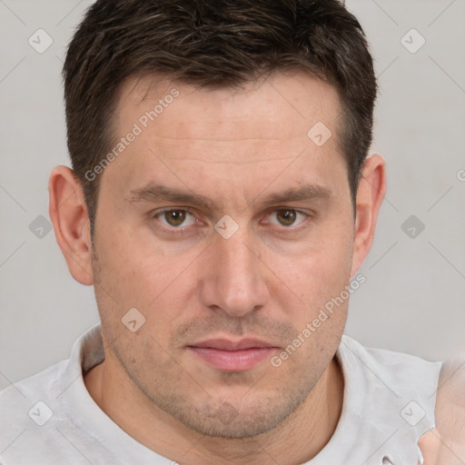 Joyful white adult male with short  brown hair and brown eyes