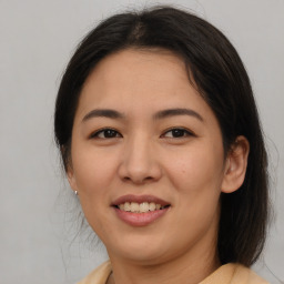 Joyful asian young-adult female with medium  brown hair and brown eyes