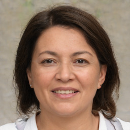 Joyful white adult female with medium  brown hair and brown eyes