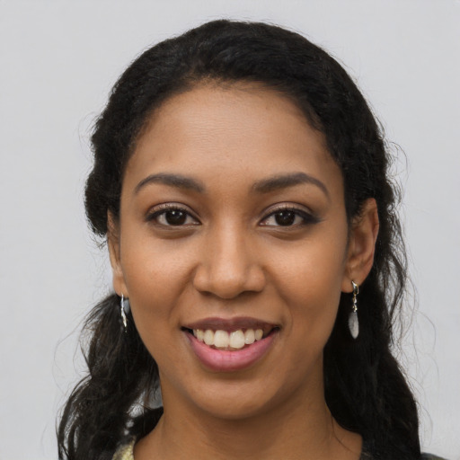 Joyful latino young-adult female with long  black hair and brown eyes