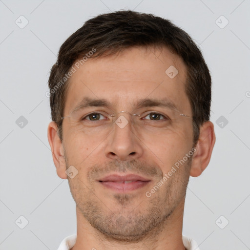 Joyful white adult male with short  brown hair and brown eyes